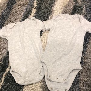 Pair of gray onsies with scalloped trim